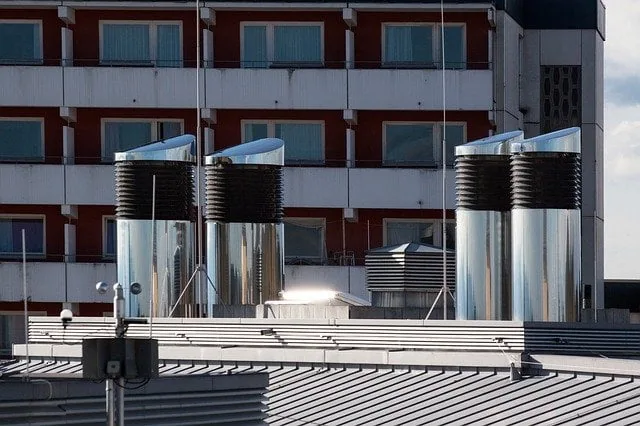 Picture of an industrial air conditioner vent on a buildings roof. 