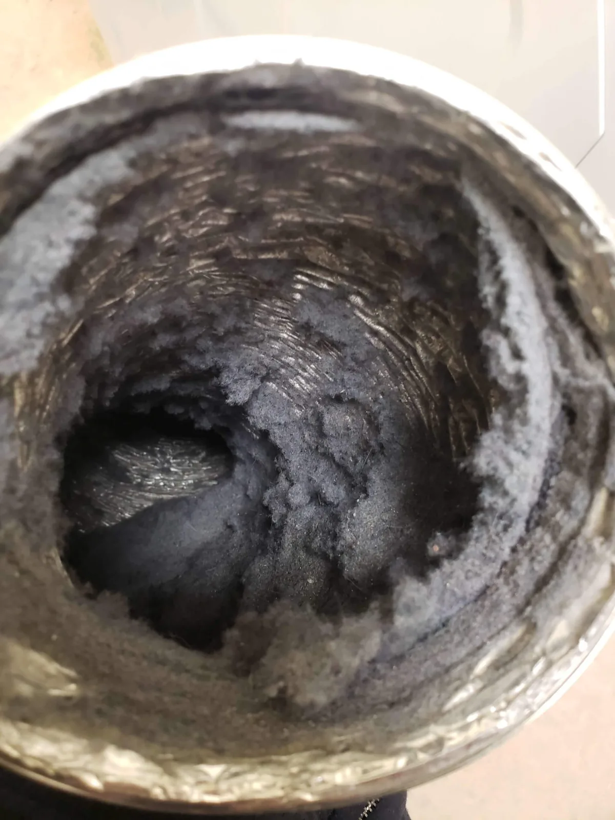 air duct filled with lint