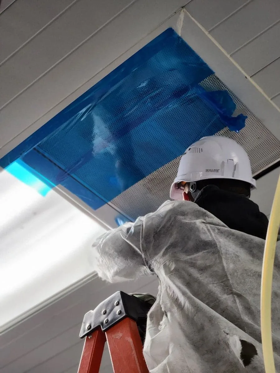 Planet Duct air duct technician working on commercial ductwork.